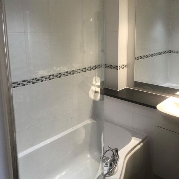 Bath and vanity unit at Wrexham property